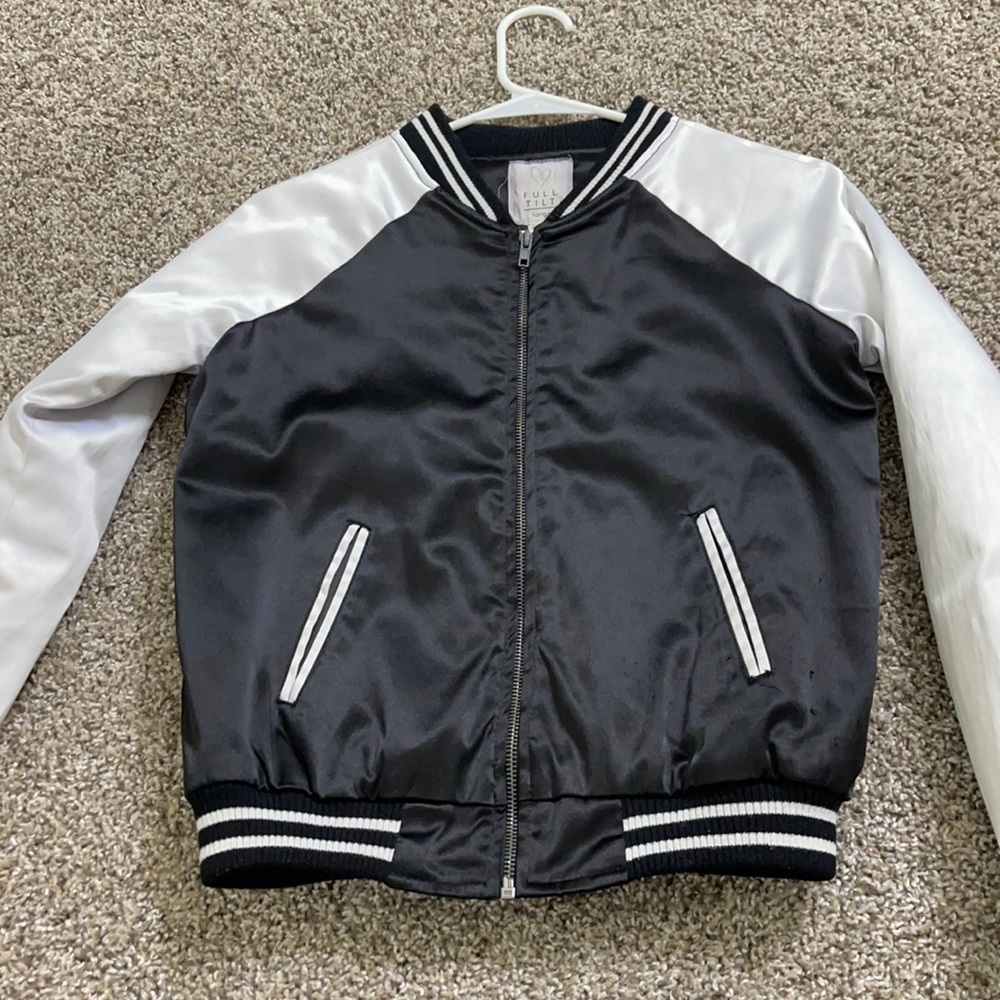 Black and white jacket, it’a a little damaged by the pockets area